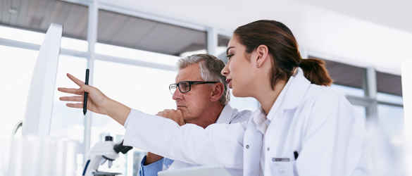 Medical research working together on a computer