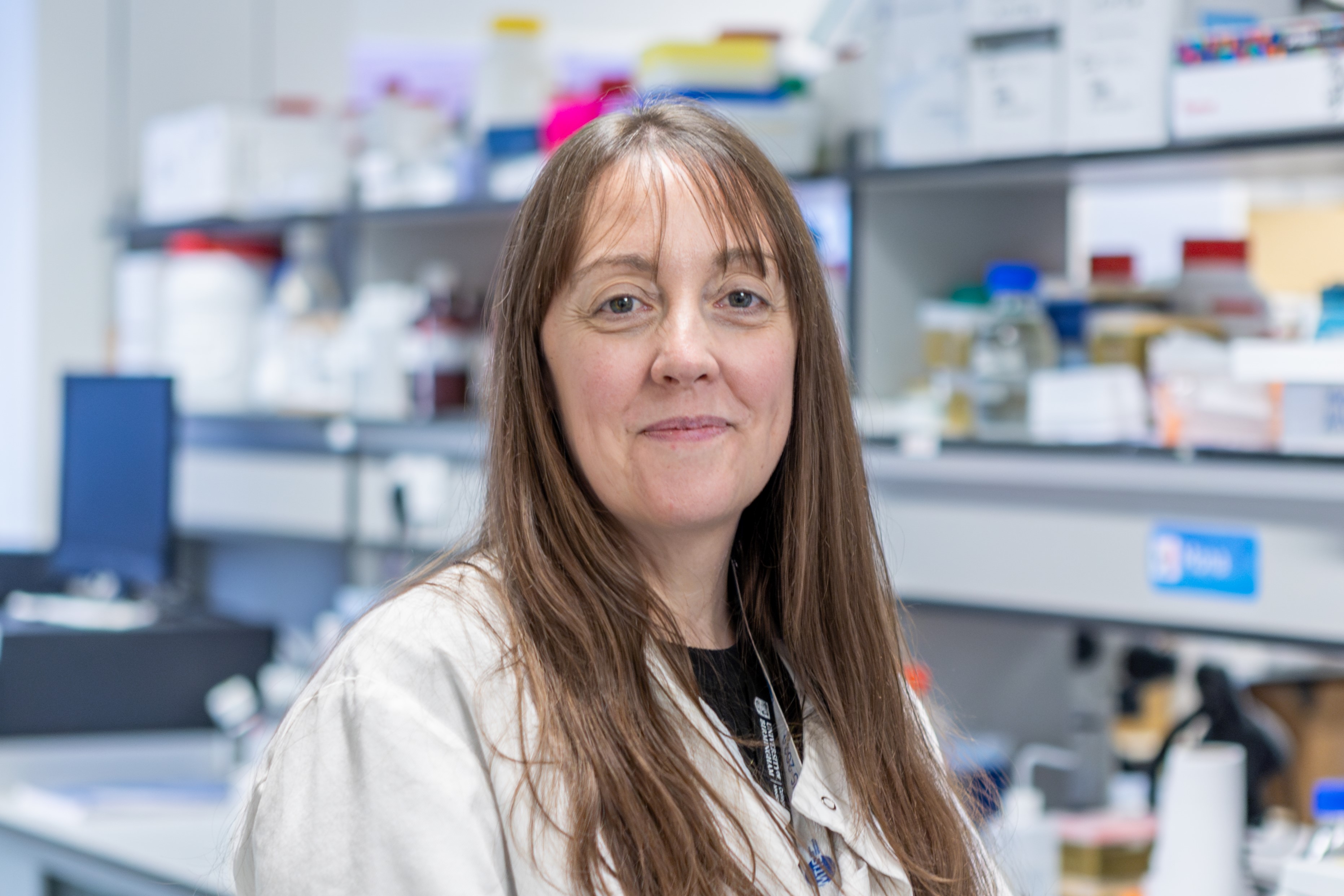 Dr Hill in the laboratory looking straight to camera