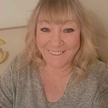 Denise Lewis smiling at camera